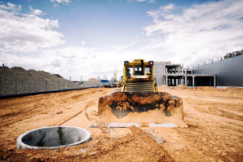 A bulldozer is moving dirt on a construction site — Hydro Excavation in Goulburn, NSW