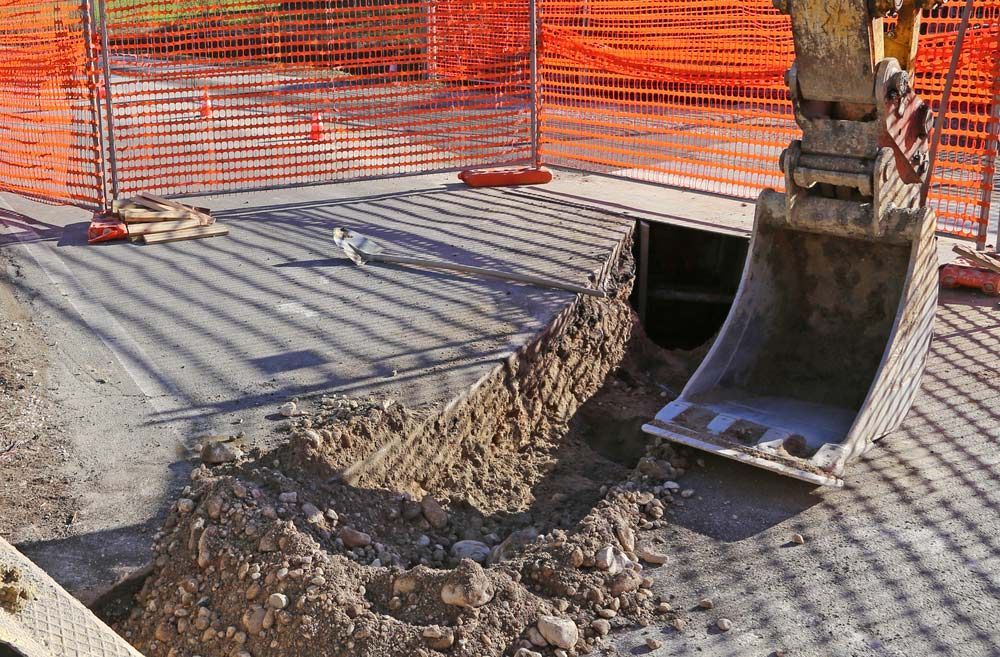 Mechanical Arm Of The Digger In The Roadworks — Hydro Excavation in Goulburn, NSW