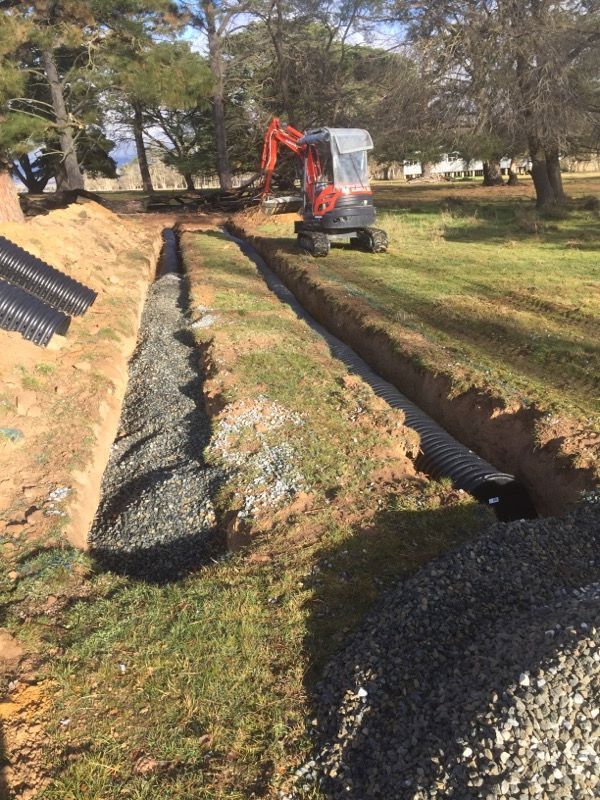 Small Excavator Preparing Trench for Septic Tank Absorption — Hydro Excavation in Goulburn, NSW
