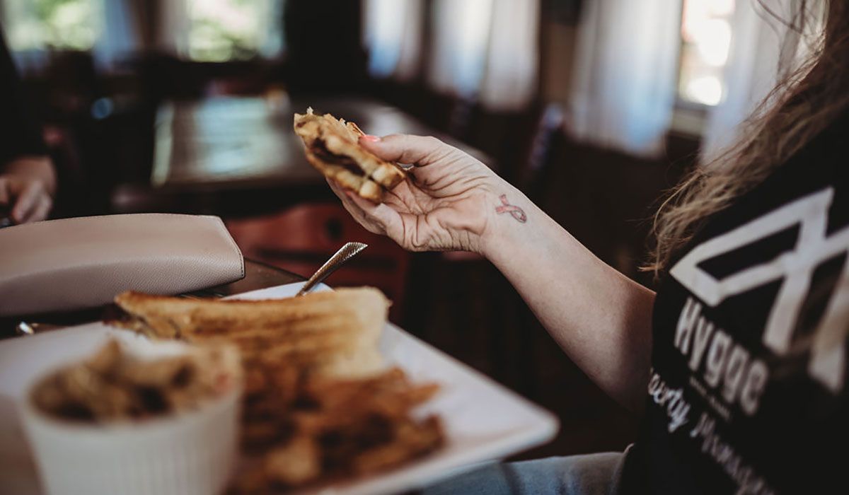 Woman eating sandwich