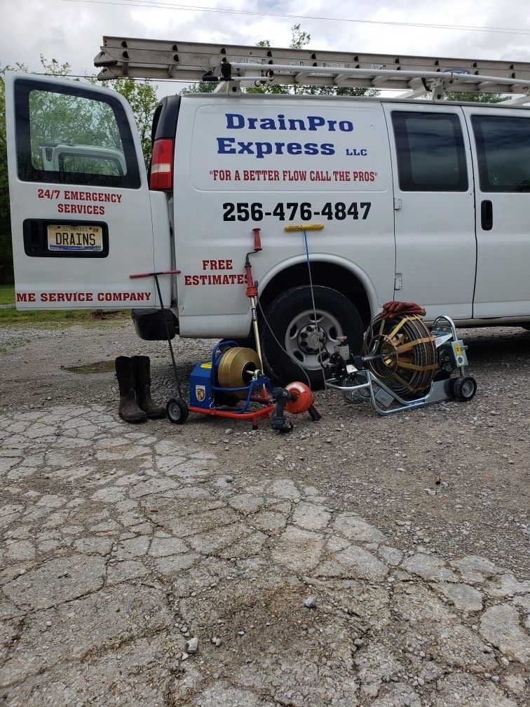 Plumber Showing Customer Pipes — Moulton, AL — DrainPro Express