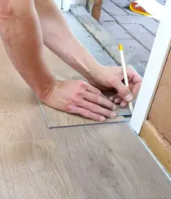 Craftsman Fitting flooring to door jamb