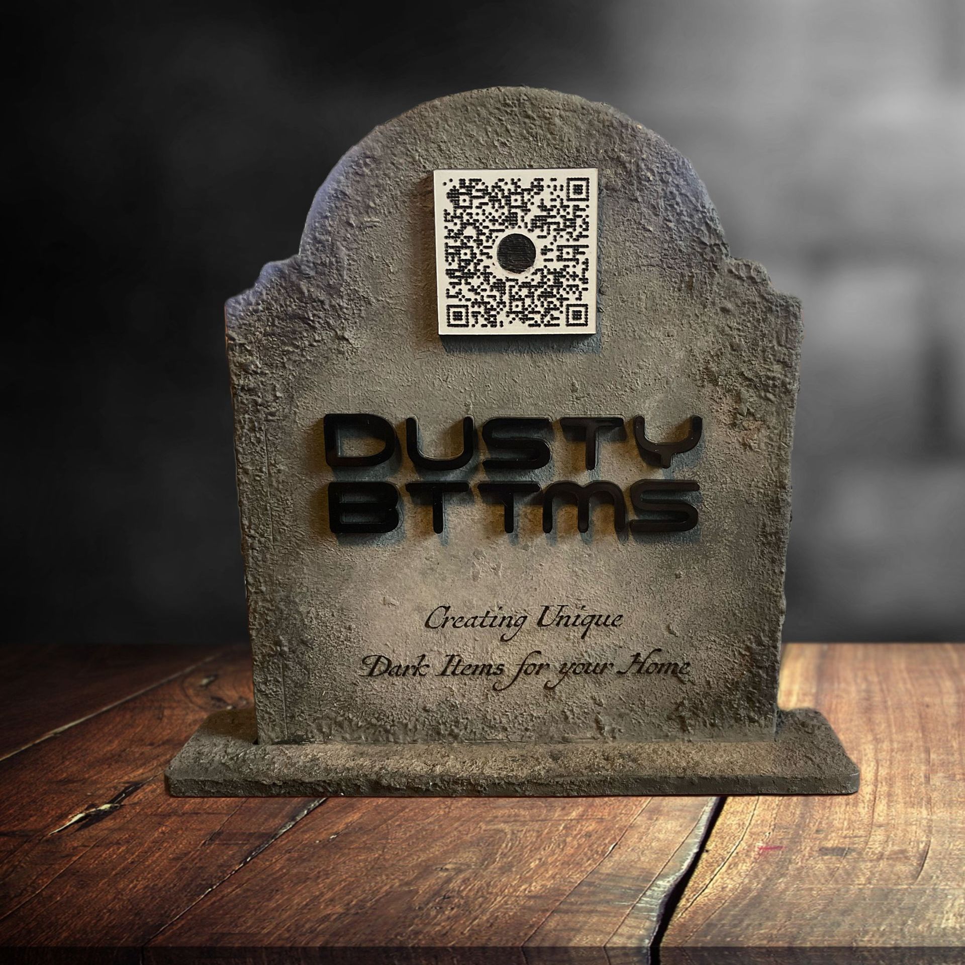 A gravestone with dusty ttms written on it