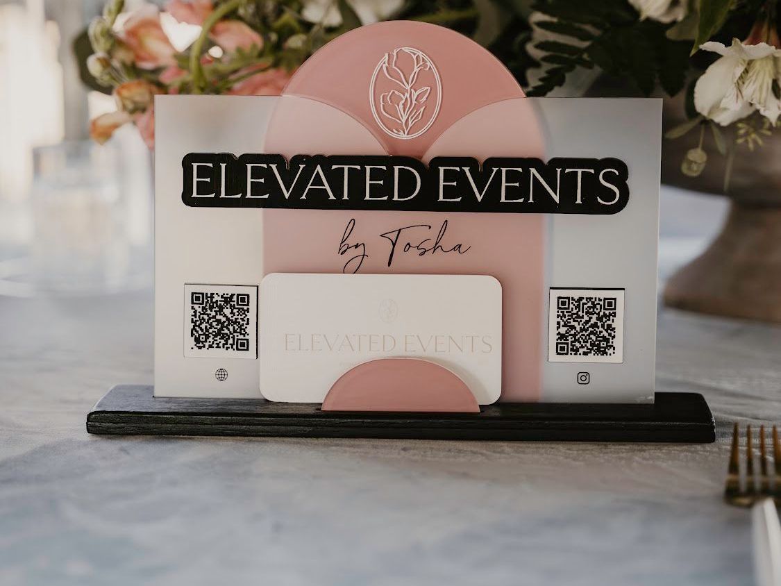 A table with a sign that says elevated events on it