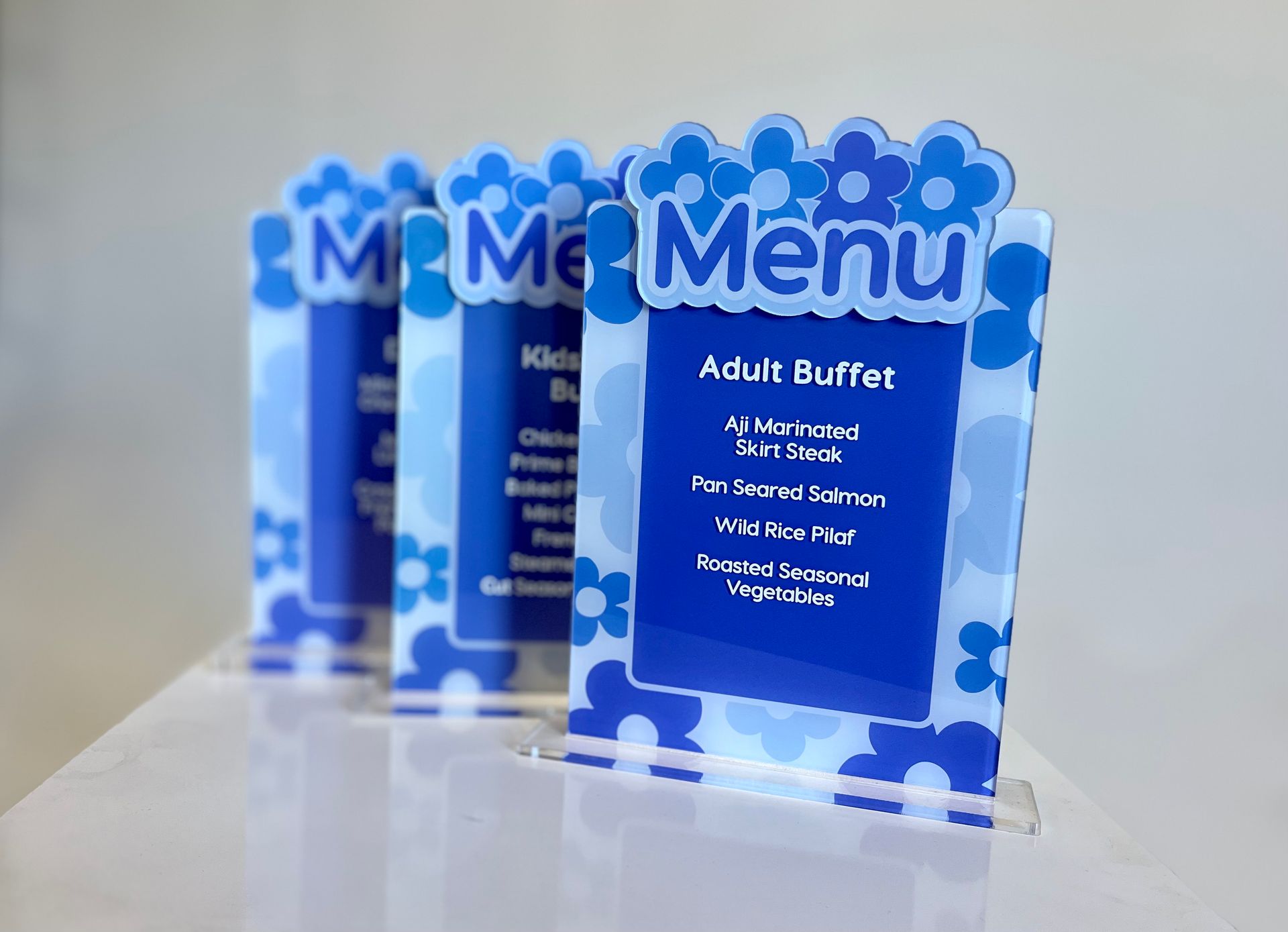 A menu for an adult buffet is displayed on a table