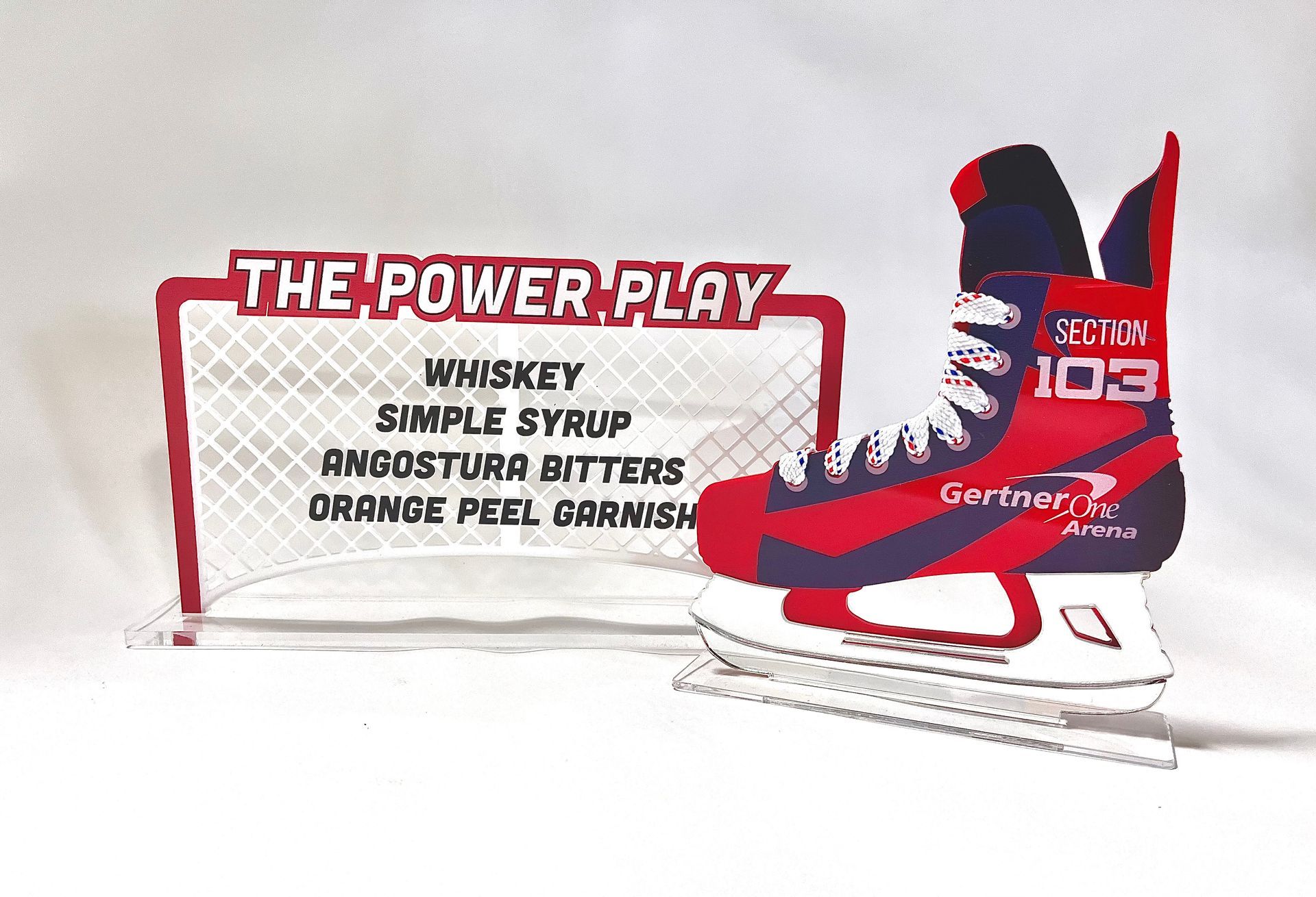 A pair of ice skates next to a sign that says the power play