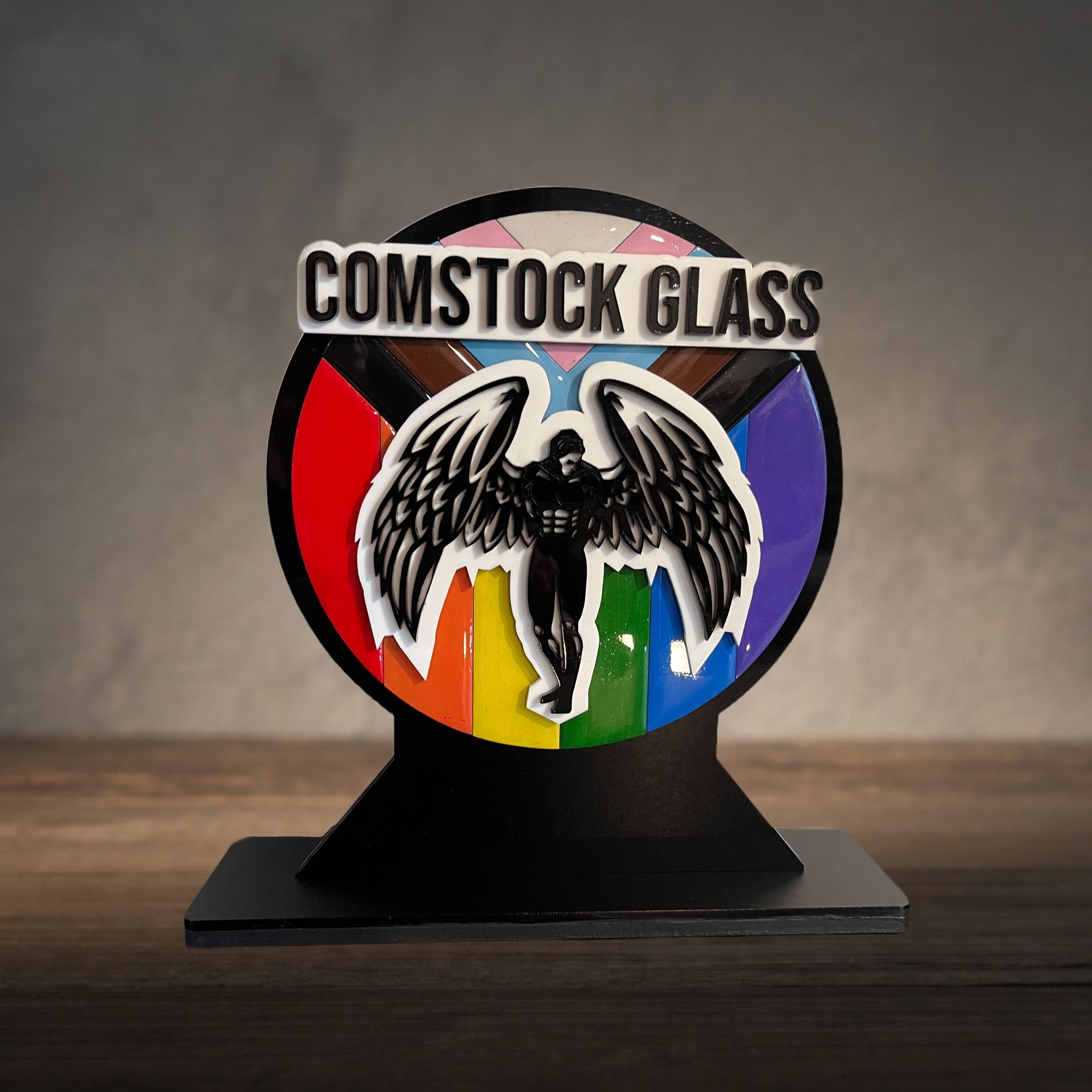 A comstock glass sticker with an angel on it