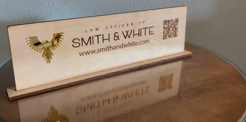 A wooden sign that says smith & white is sitting on a table.