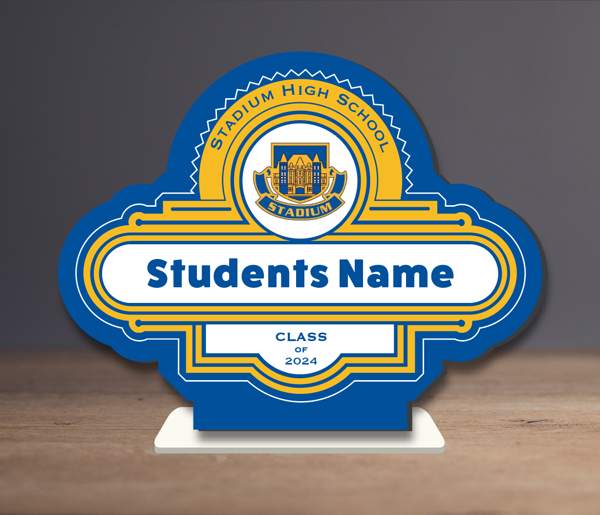 A blue and yellow sign that says students name on it