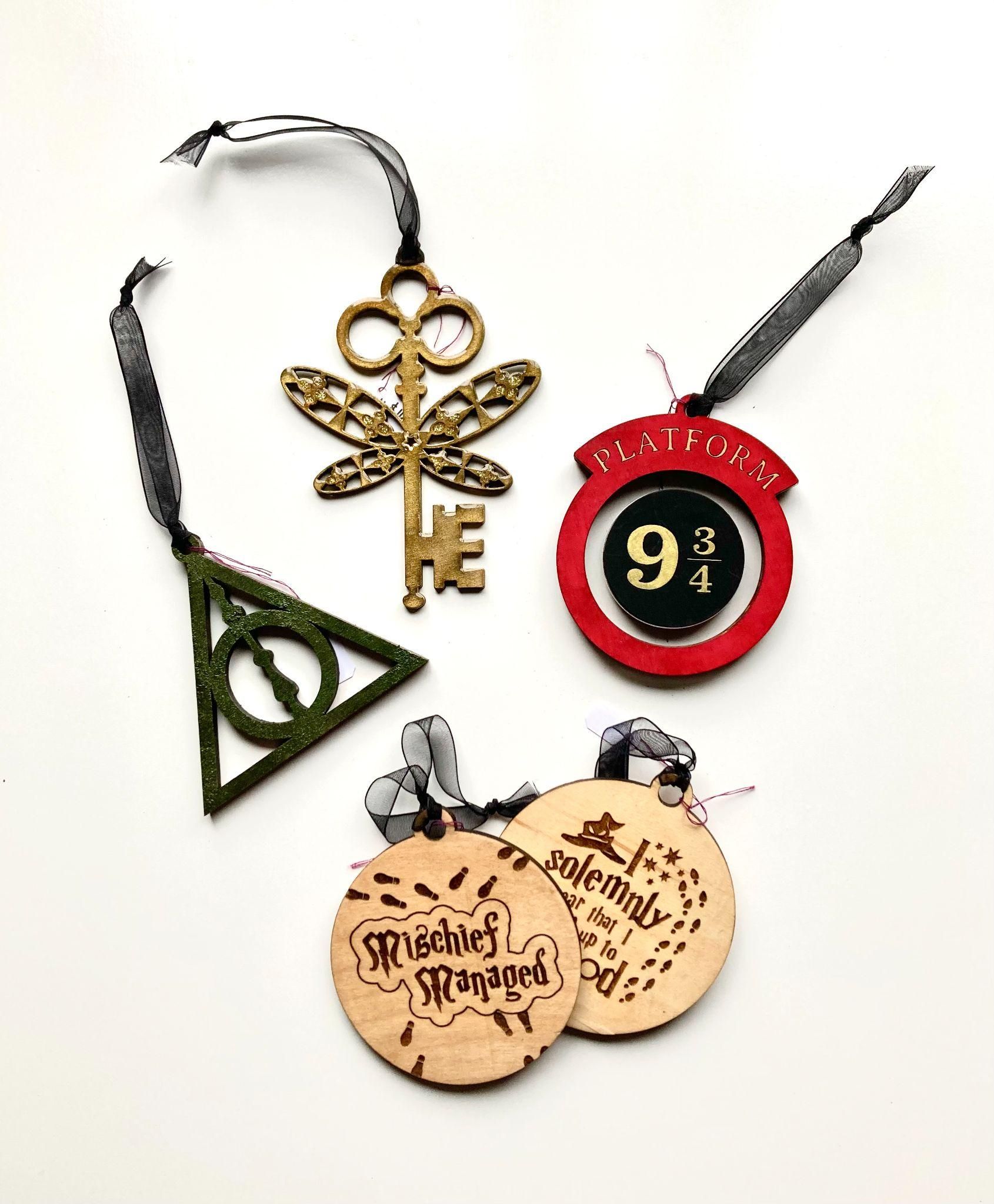 A group of harry potter ornaments on a white surface