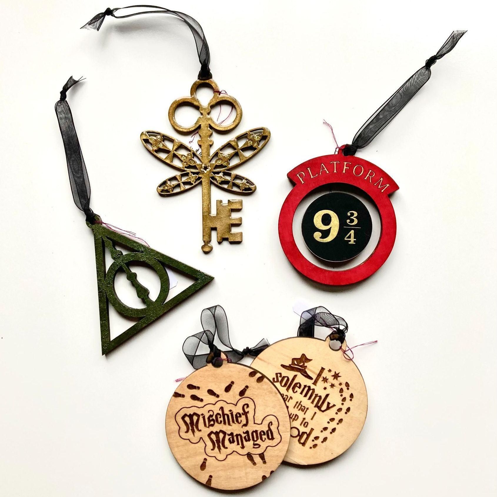 A group of harry potter ornaments are sitting on a table.