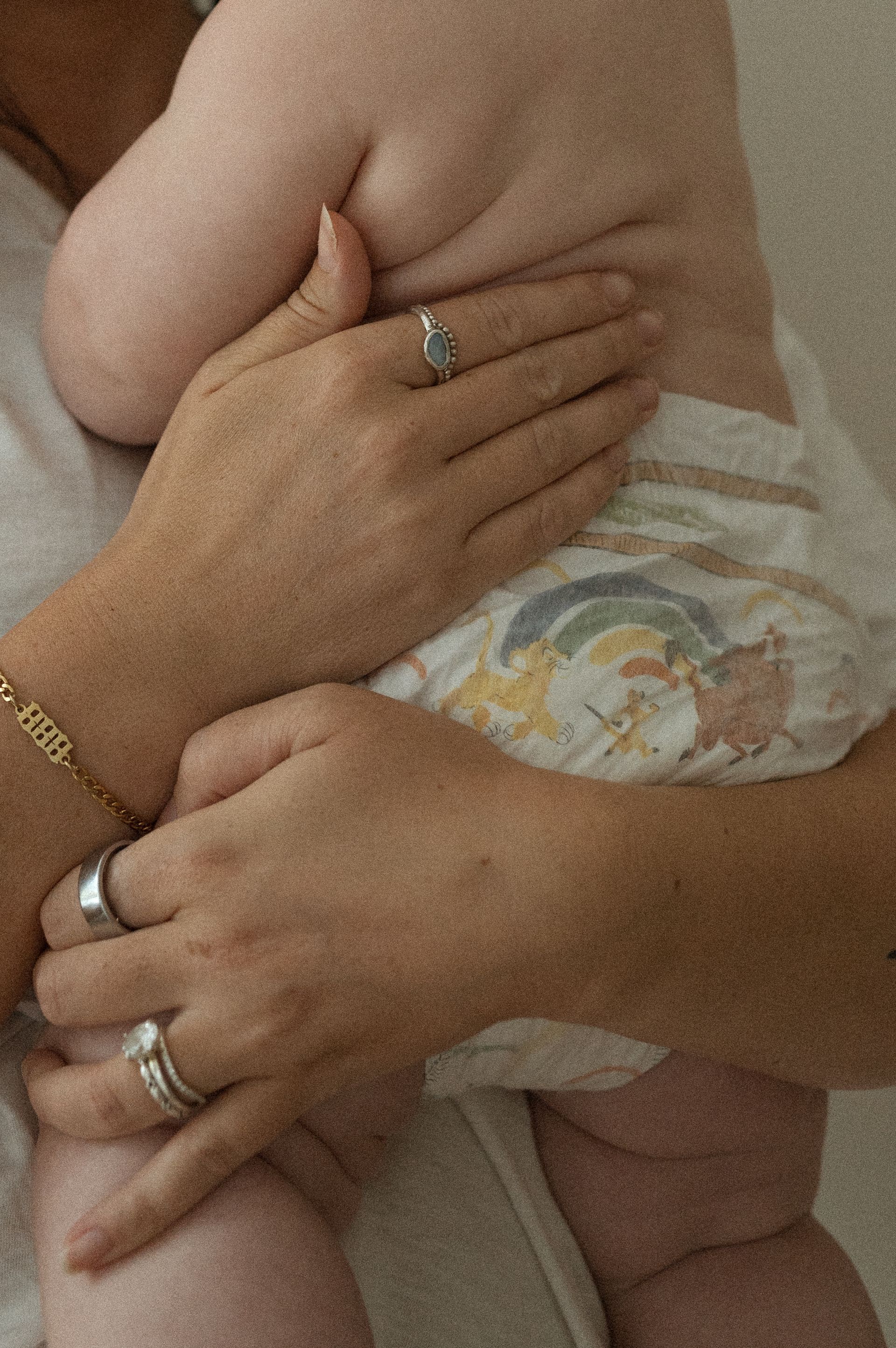 A close up of a mom holding her baby