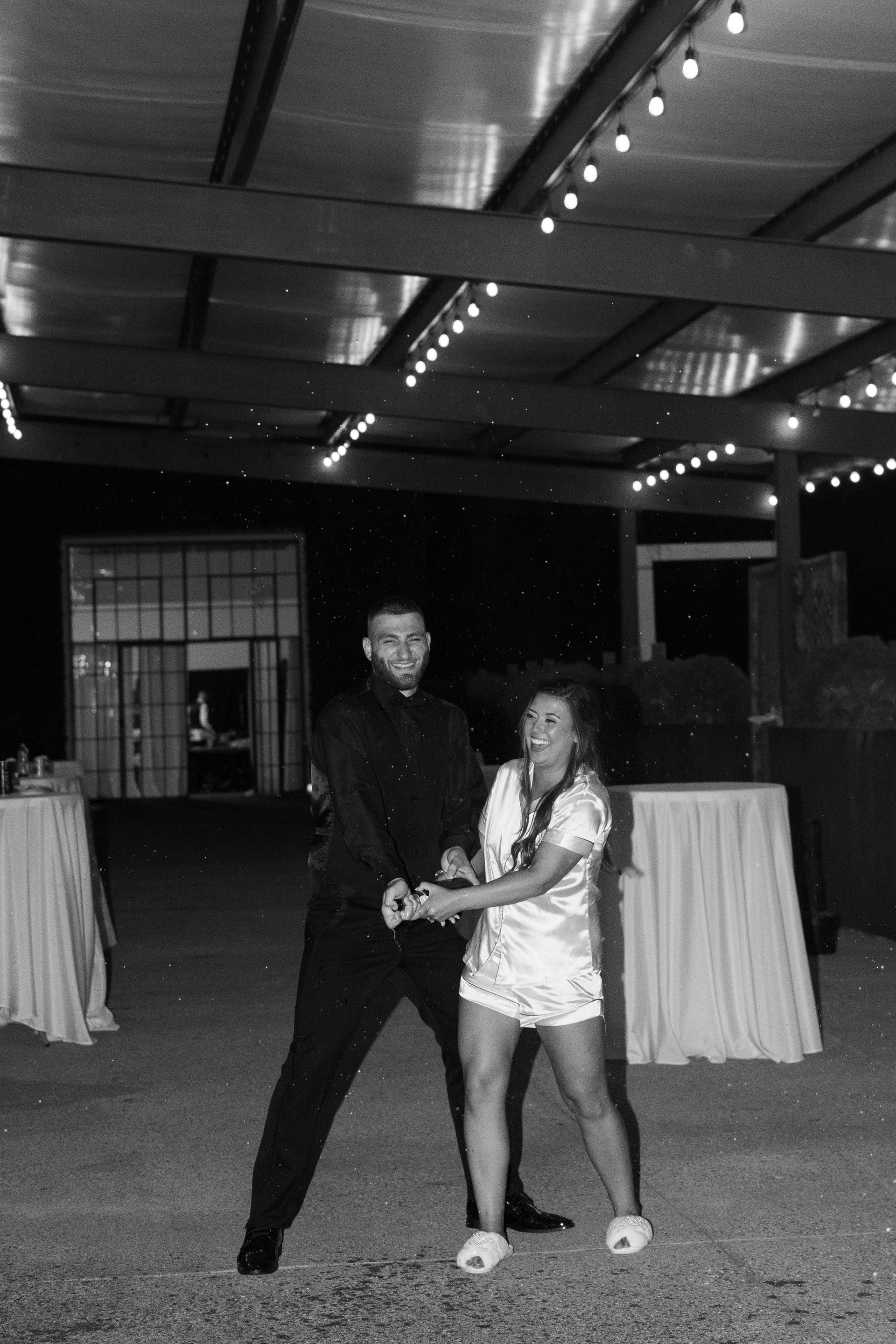 A black and white photo of a man and woman dancing