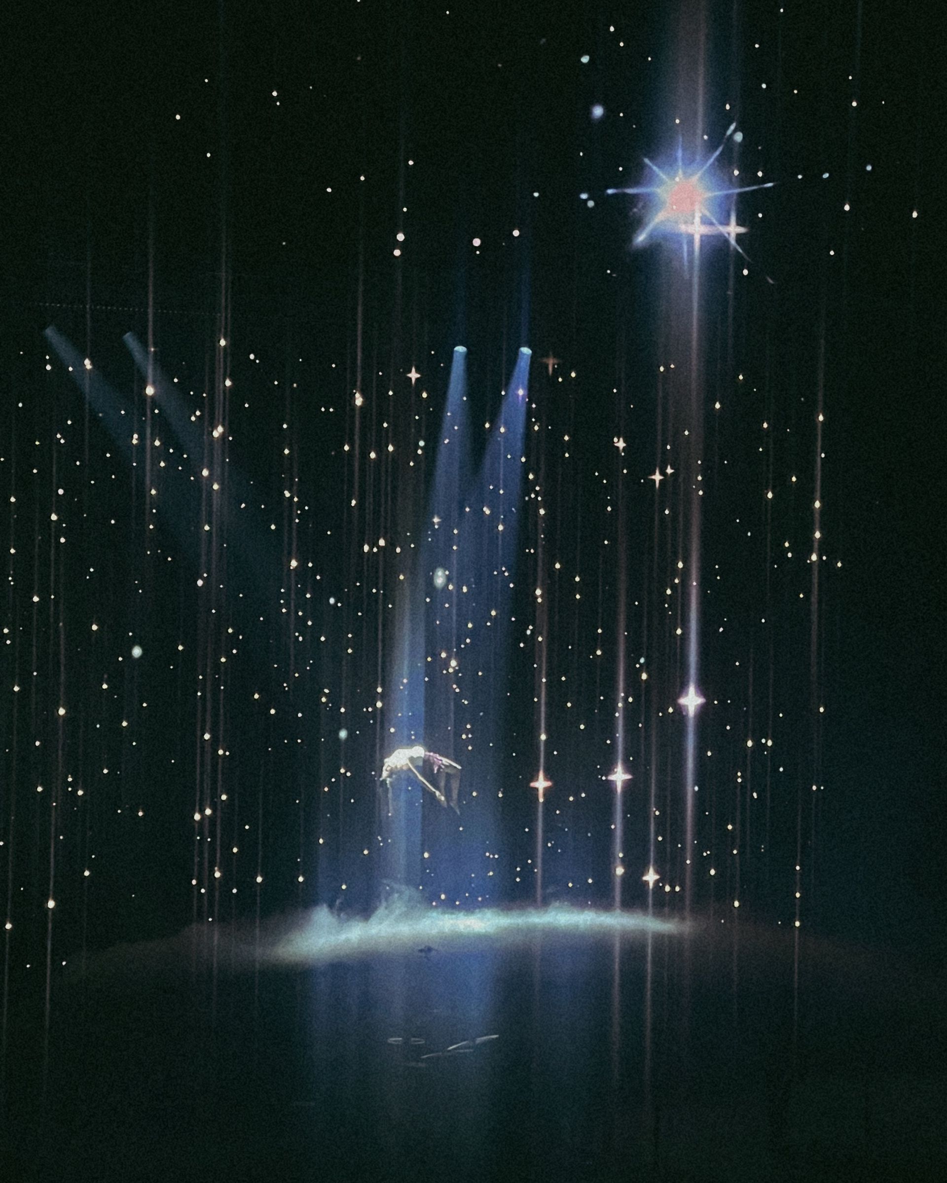 A stage with a lot of lights and stars on it