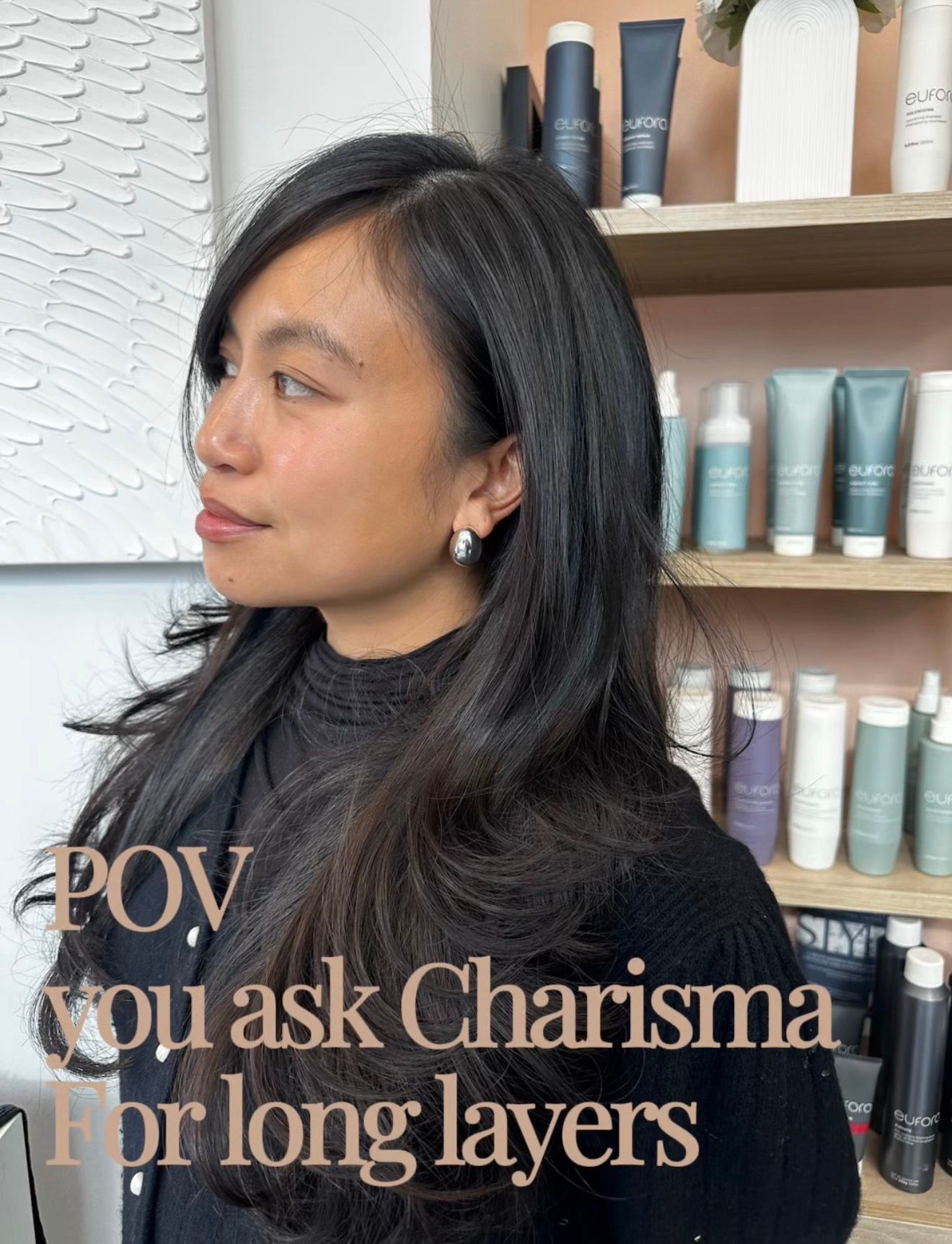 Woman with dark layered hair, in a salon setting. Text reads 