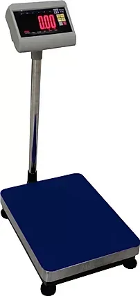 A digital scale is sitting on top of a blue table.