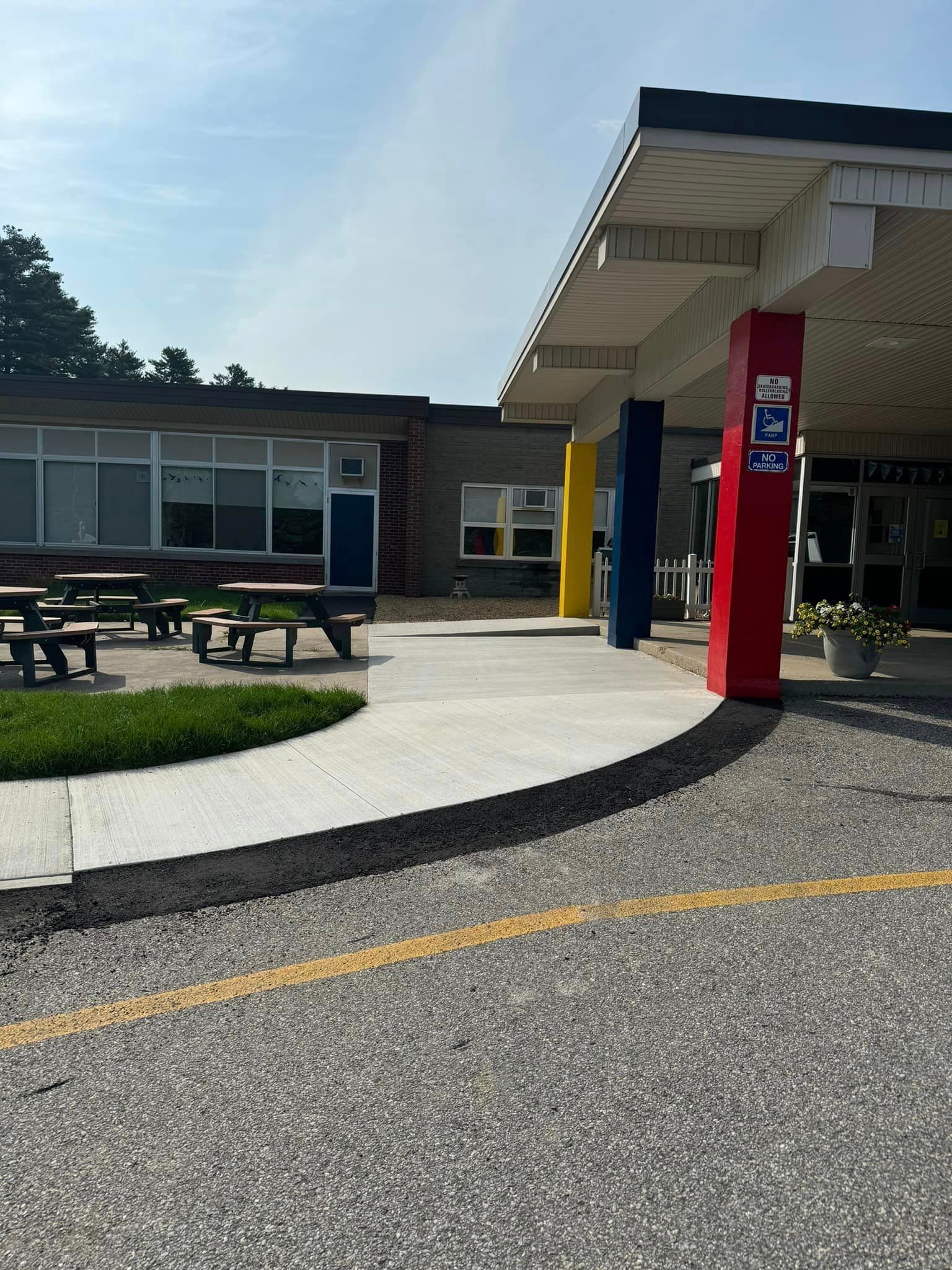 A building with a handicapped parking sign in front of it