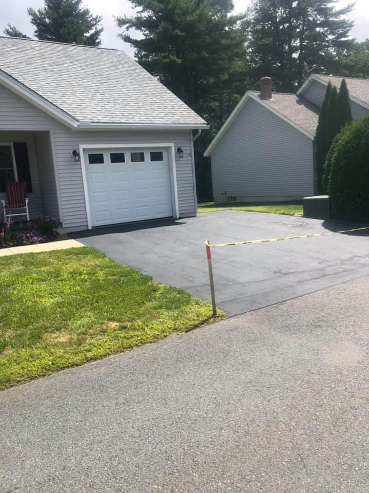 A house with a white garage door and a driveway