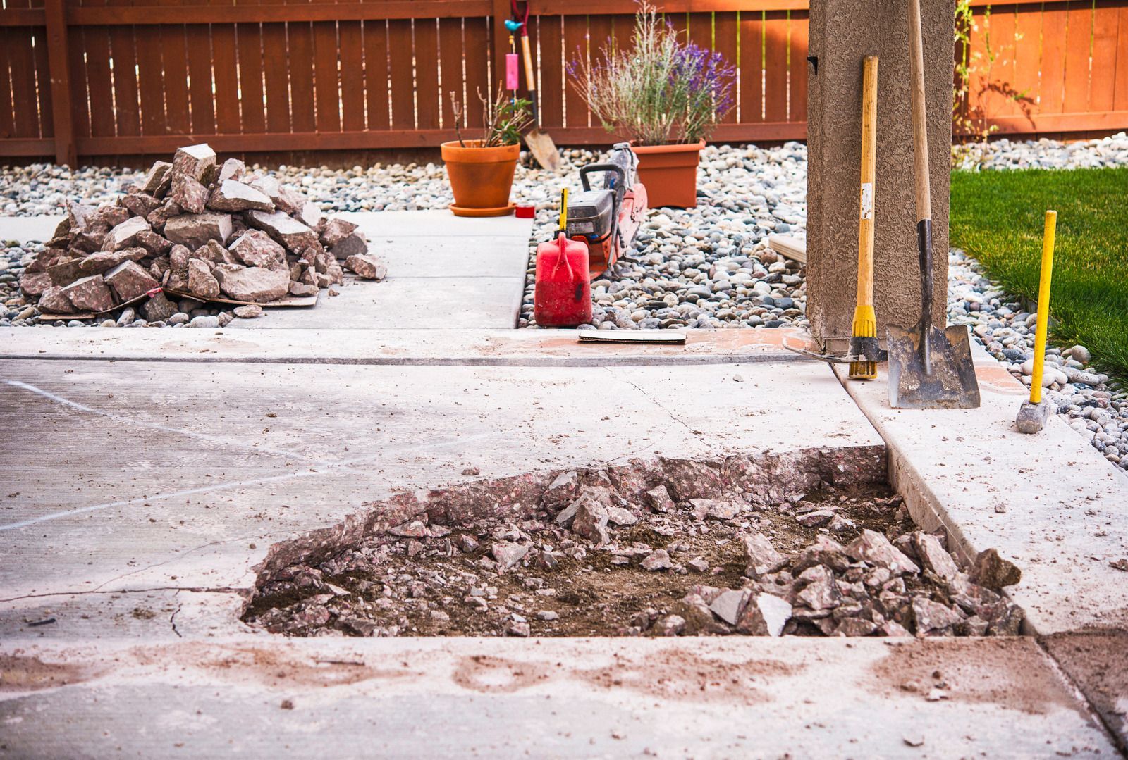 A pile of rocks is sitting on top of a concrete patio.