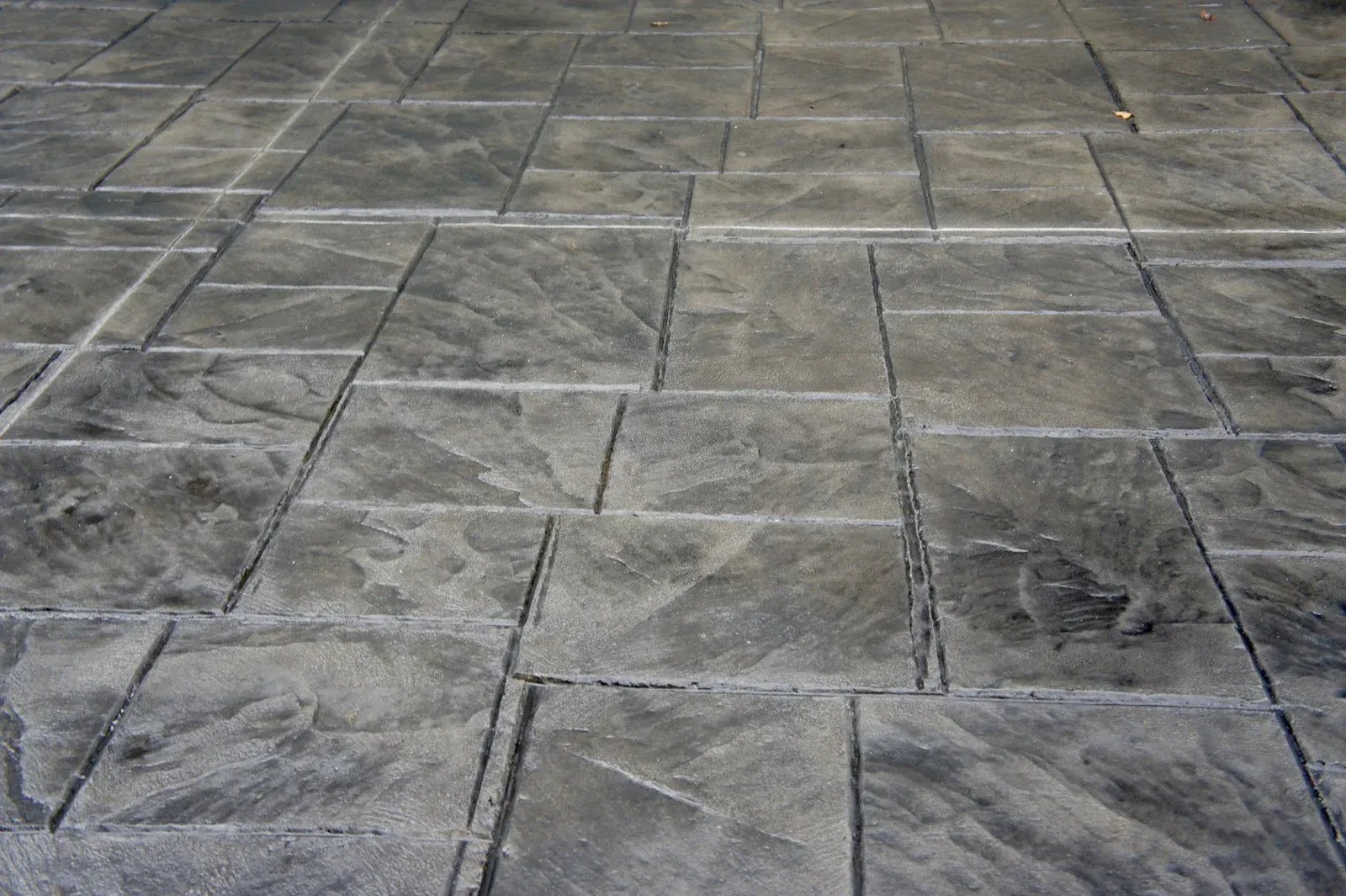 A close up of a gray tiled floor