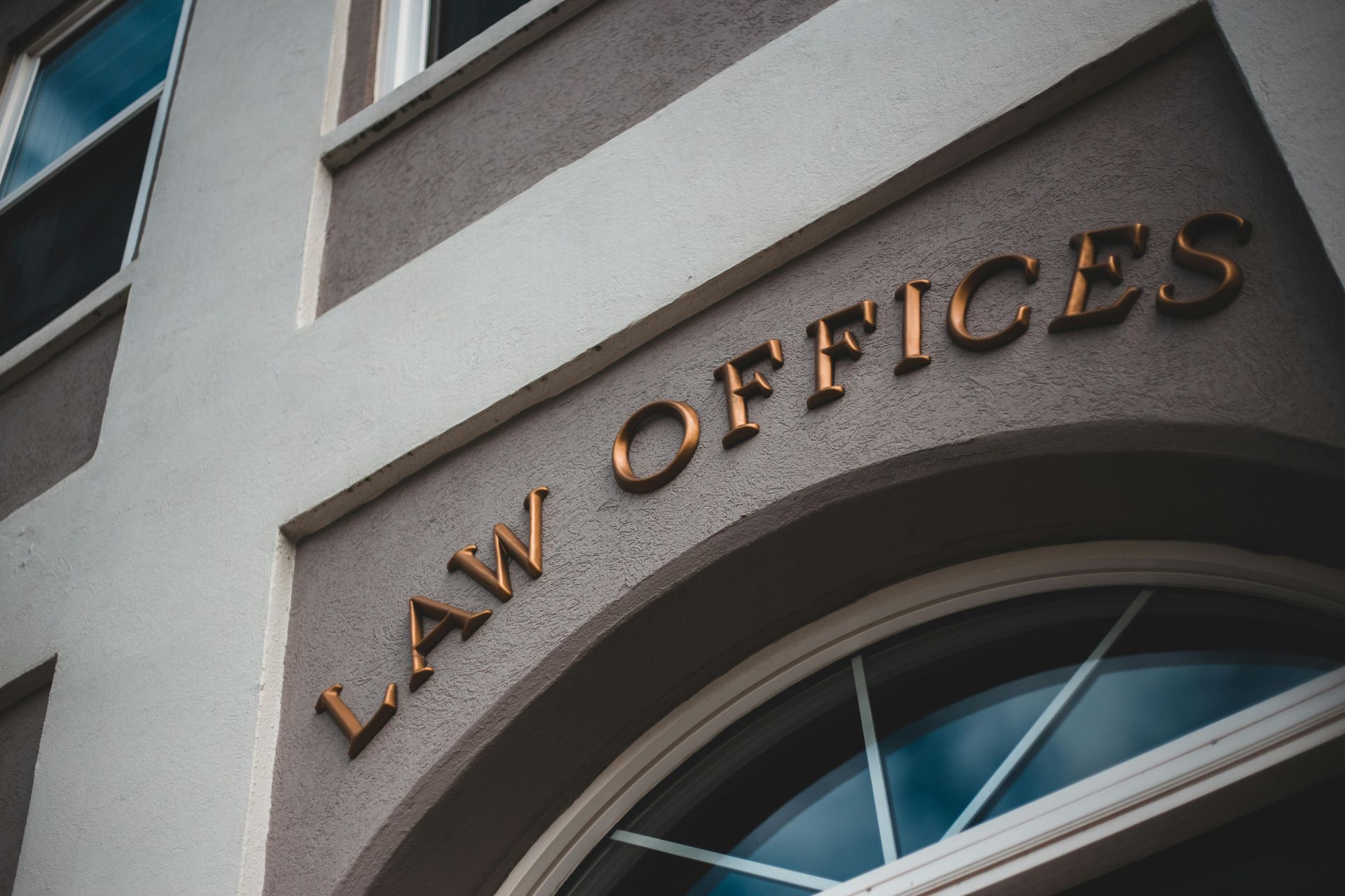 Law Offices sign on an arched building facade
