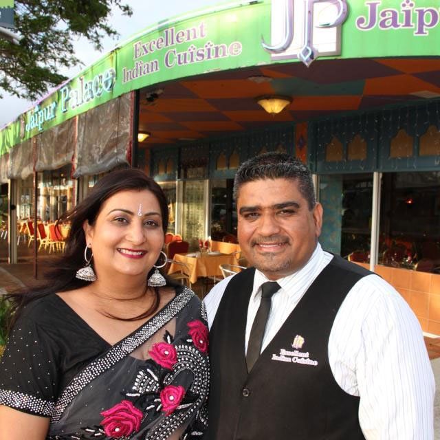 Young couple standing in front of Jaipur Palace