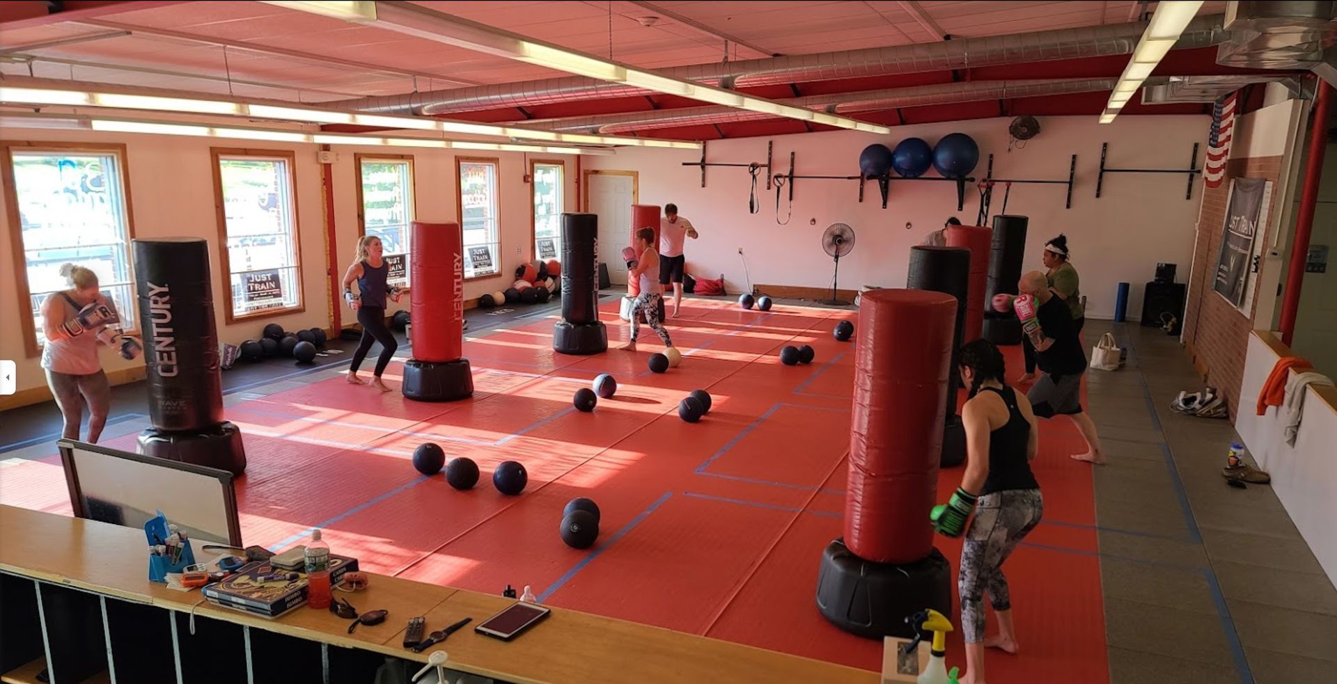 a group of people are boxing in a gym .