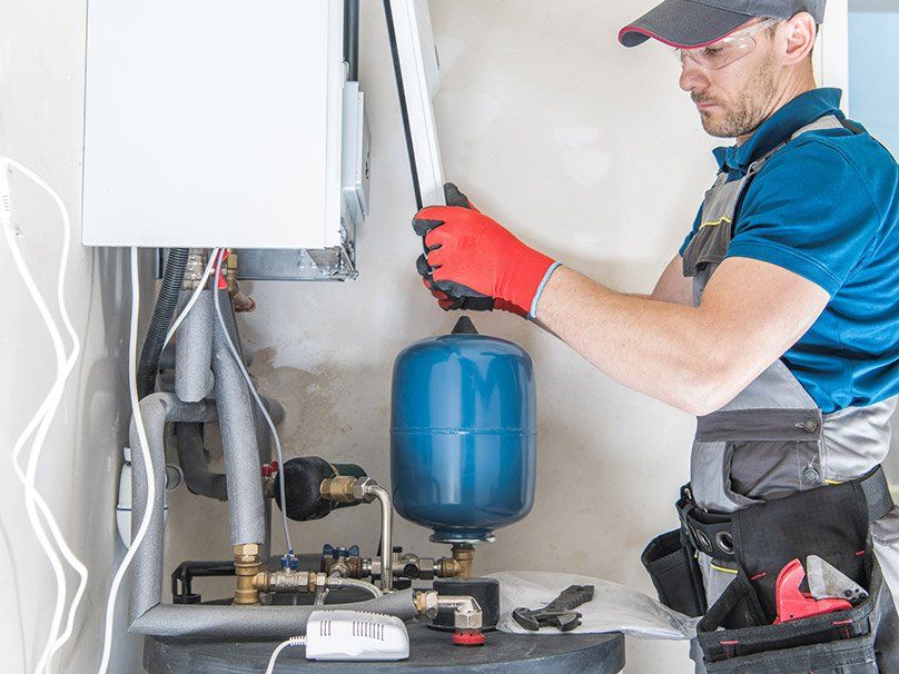 A professional doing a furnace installation in Shreveport, LA