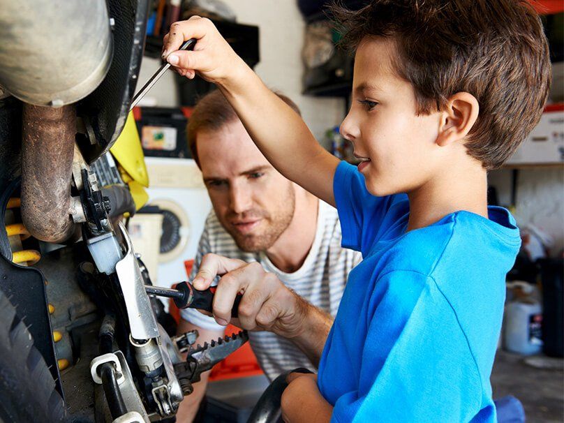 Father And Son Fixing Something — Bossier City, LA — Brooks Heating & Air Conditioning