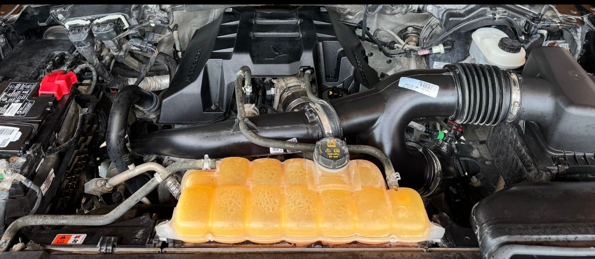 A look under the hood at the results of an engine bay cleaning