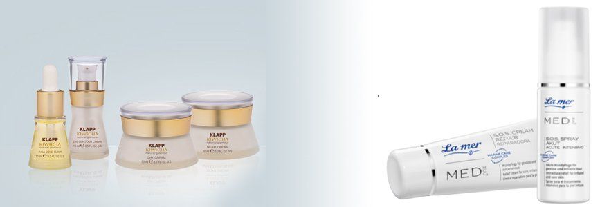 Kosmetikprodukte: Flaschen und Tiegel in Gold und Weiß, arrangiert auf hellem Hintergrund.