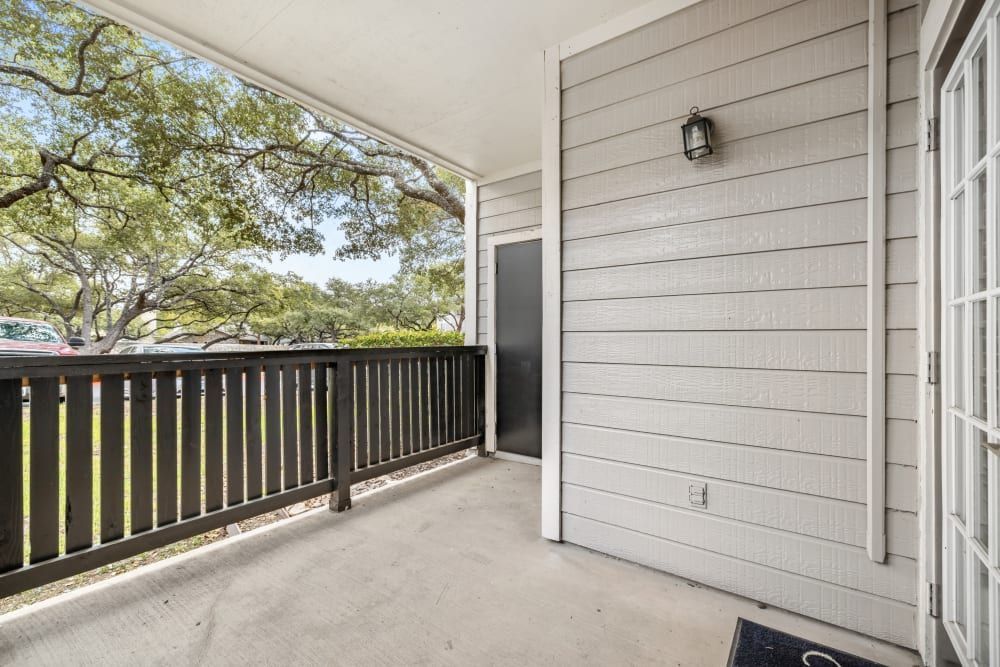a balcony with a railing and a door in a house at Marquis at Deerfield in San Antonio, TX.