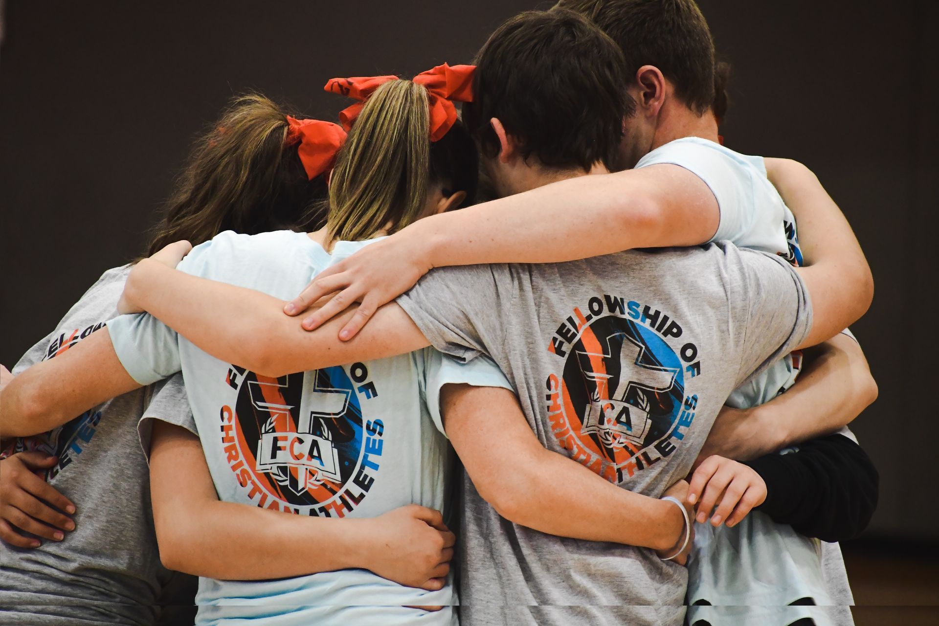 Circle of people huddling up