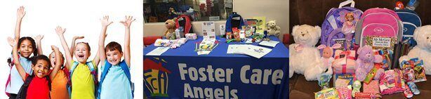 A group of children are standing in front of a table that says foster care angels