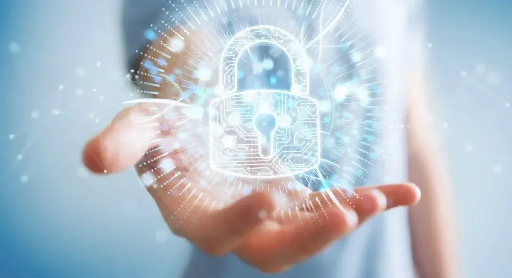 A person is holding a digital padlock in their hand.