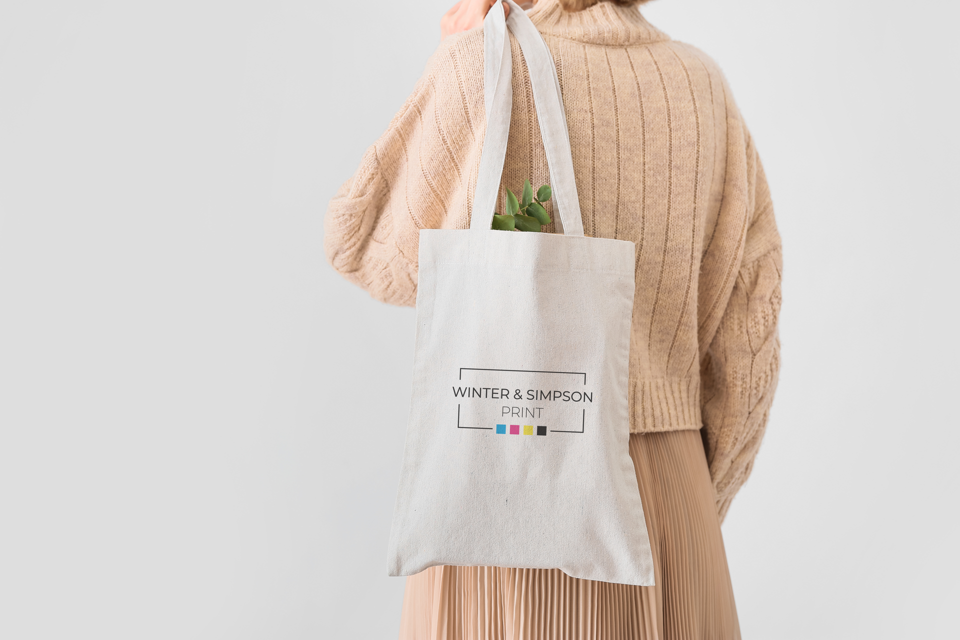 Women with branded tote bag