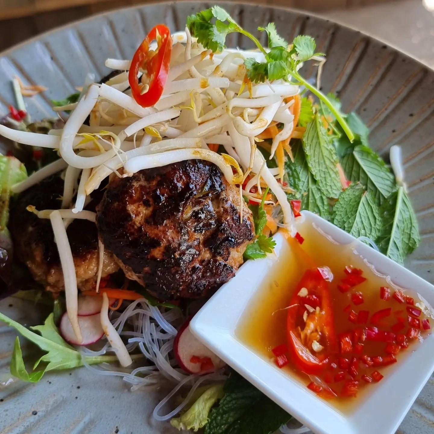 A close up of a plate of food with sauce on it