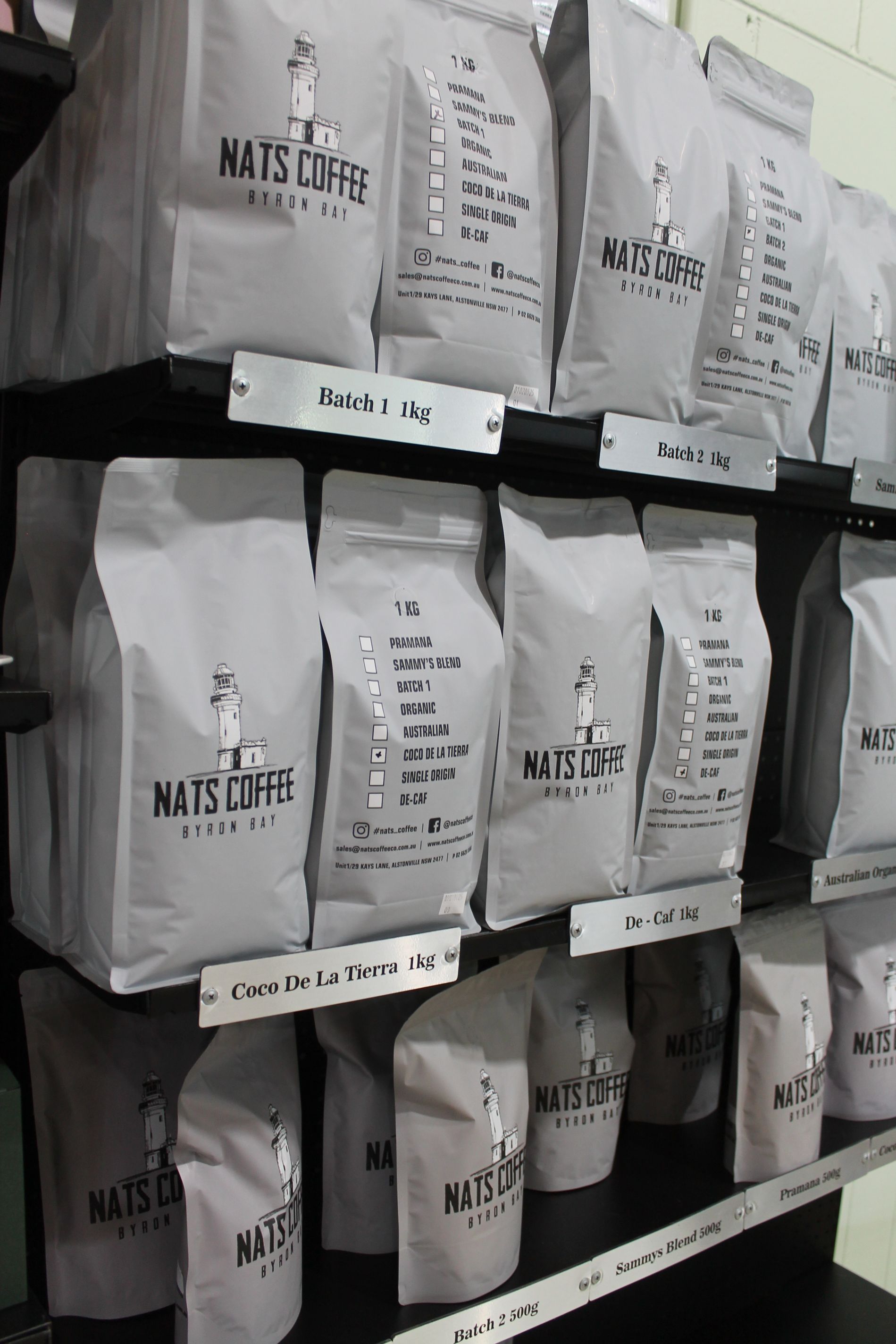 Three Water Filters Are Hanging on A Blue Pipe on A Wall — Nat’s Coffee in Alstonville, NSW