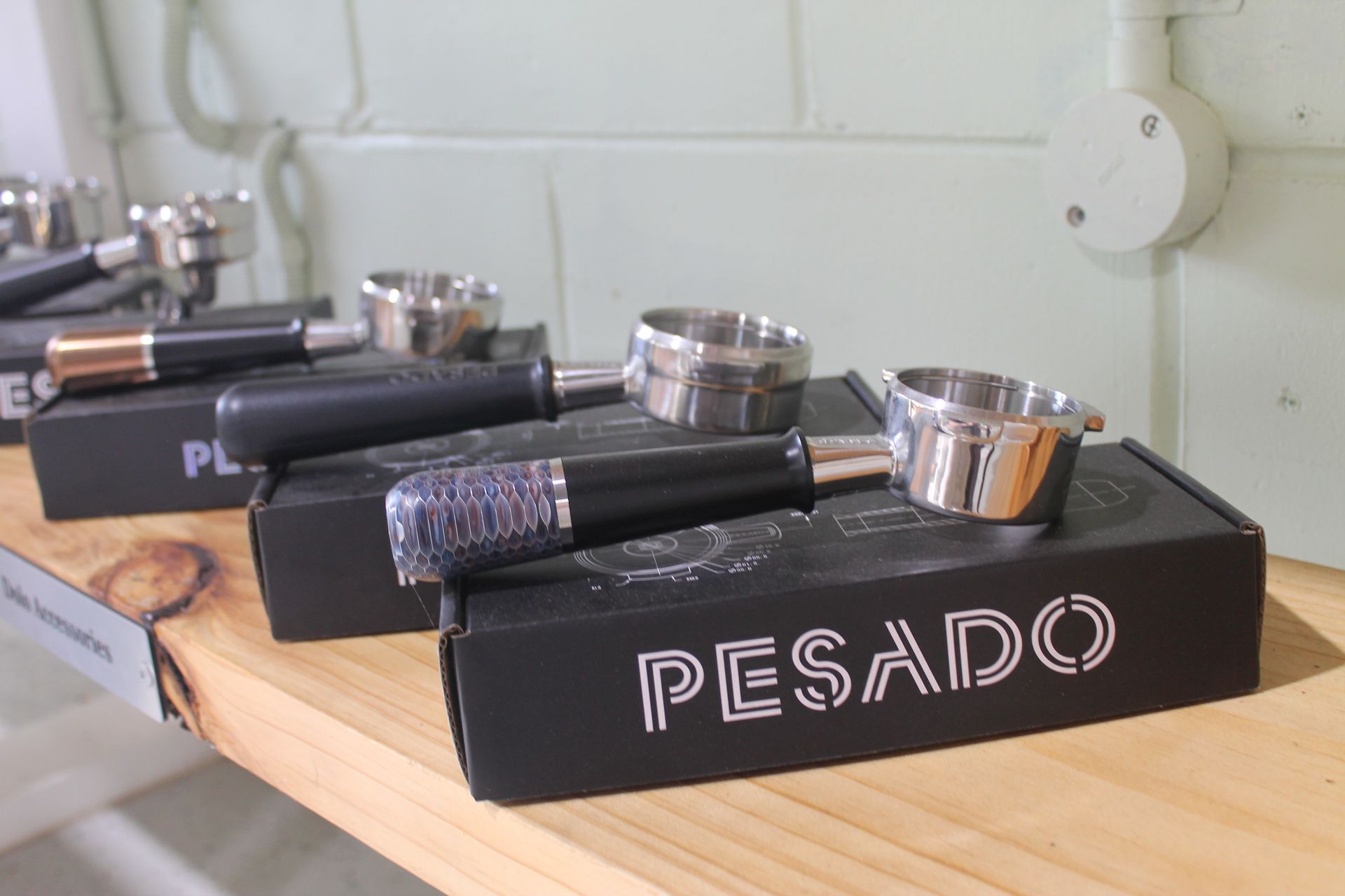 A row of coffee presses on a shelf — Nat’s Coffee in Alstonville, NSW