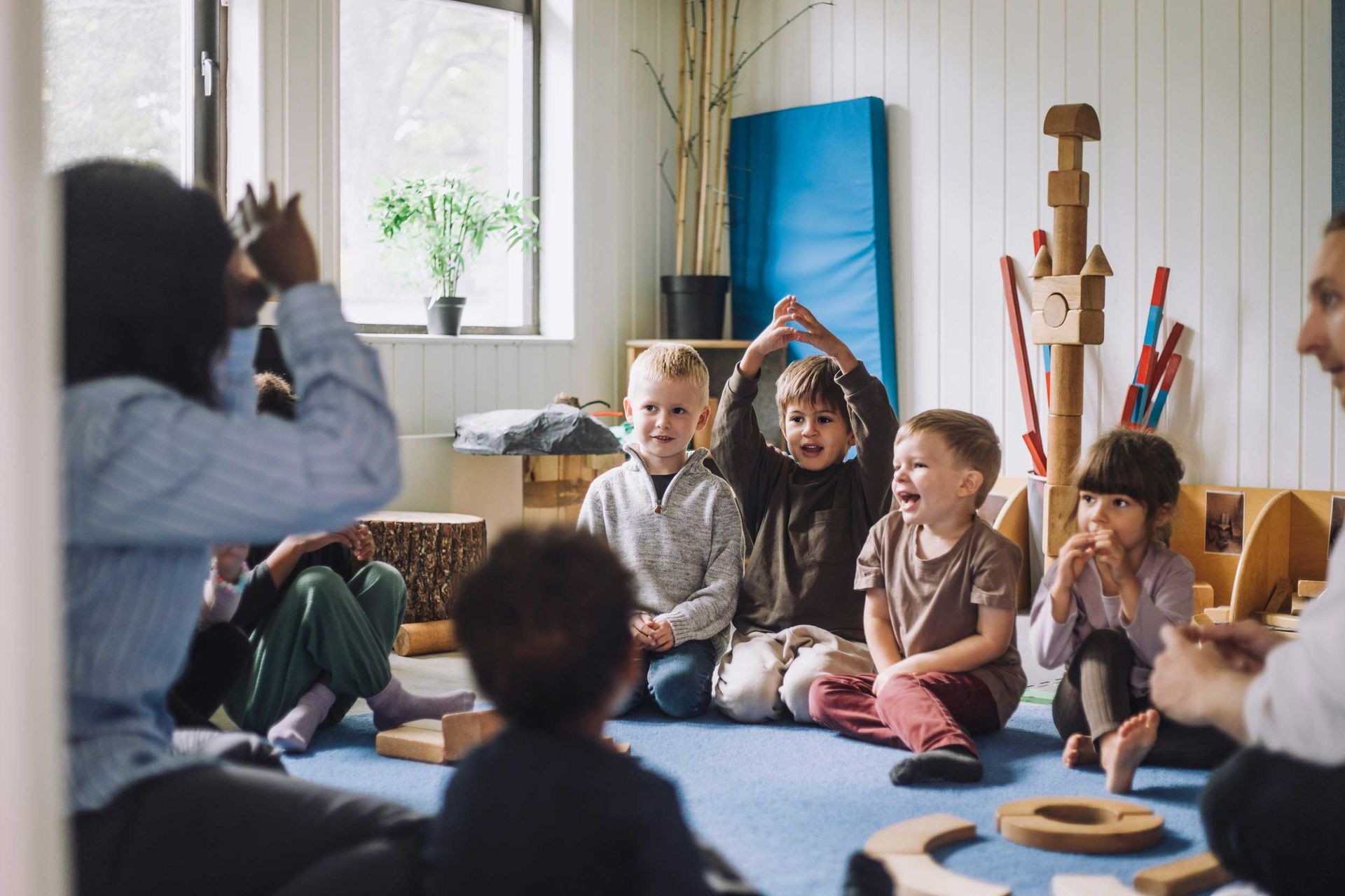 A teacher is teaching a group of children at a child care center.