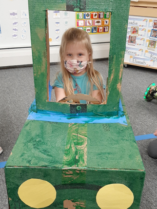 Kid on Cardboard Truck — Parsippany, NJ — Carousel Of Learning, Early Learning Center & Child Care