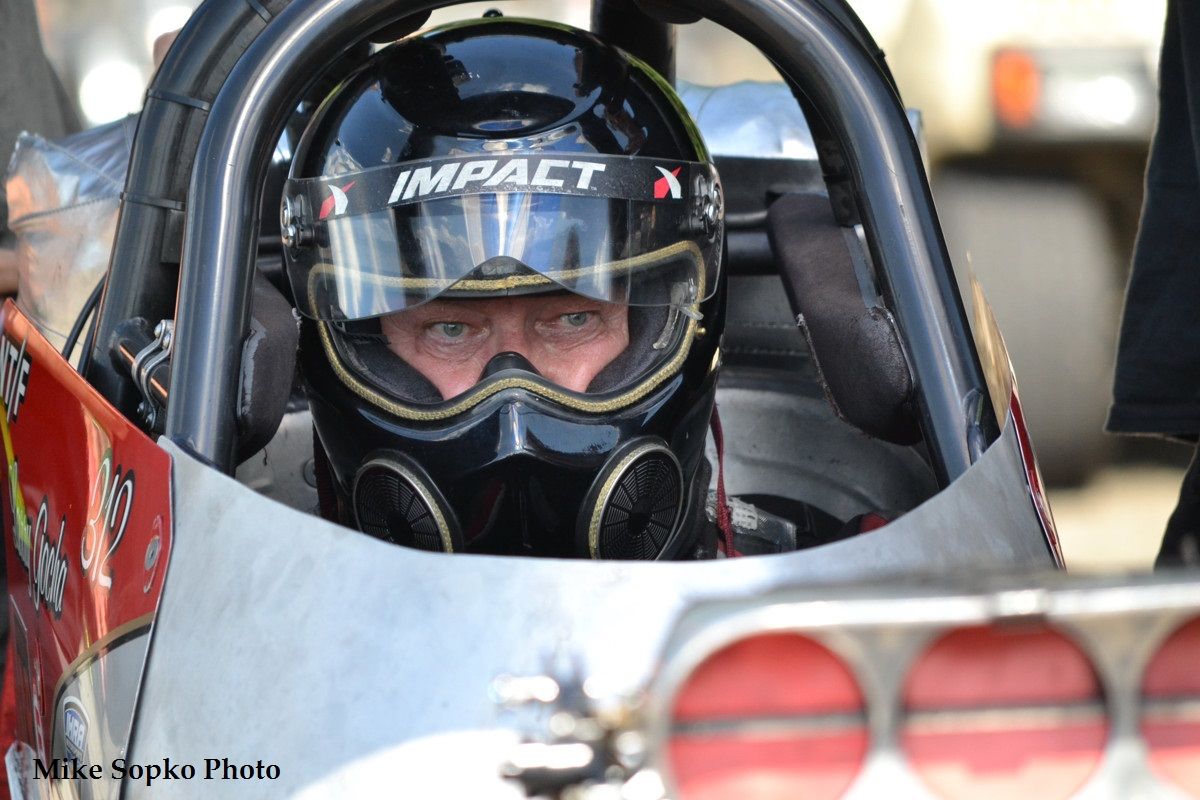 A man wearing a helmet with the word impact on it