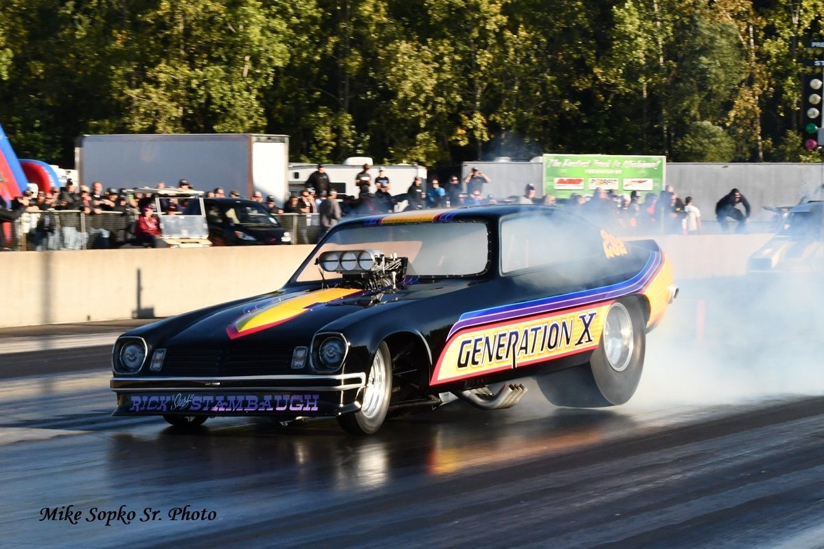 A black car with the word generation x on the side