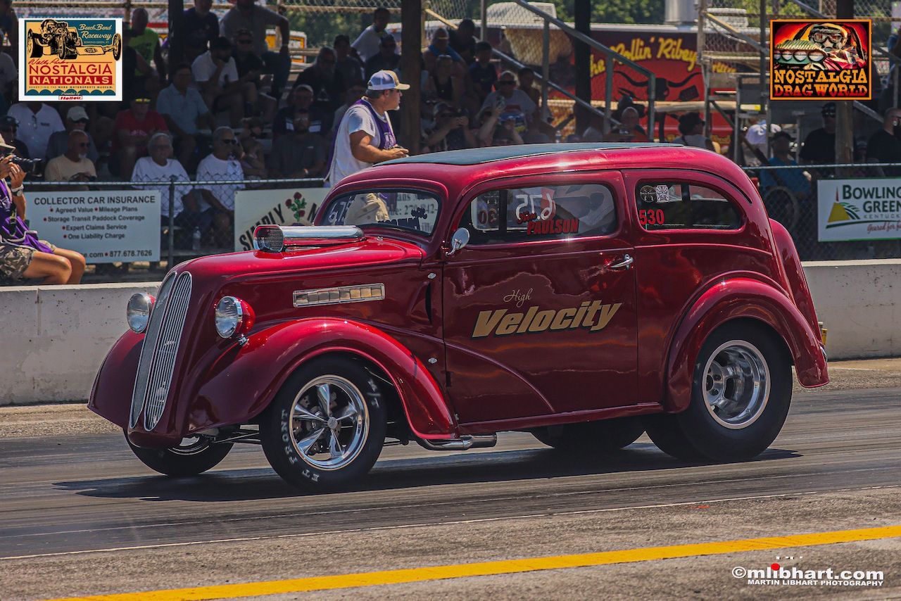 A red car with the word velocity on it