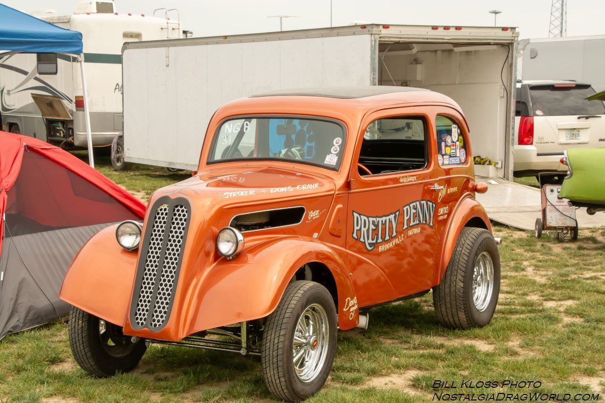 An orange car with the word pretty on it