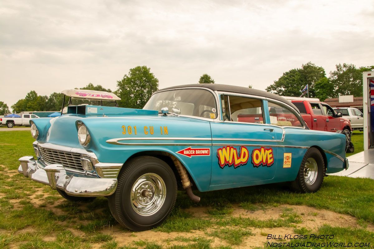 A blue car with the words wild one on the side