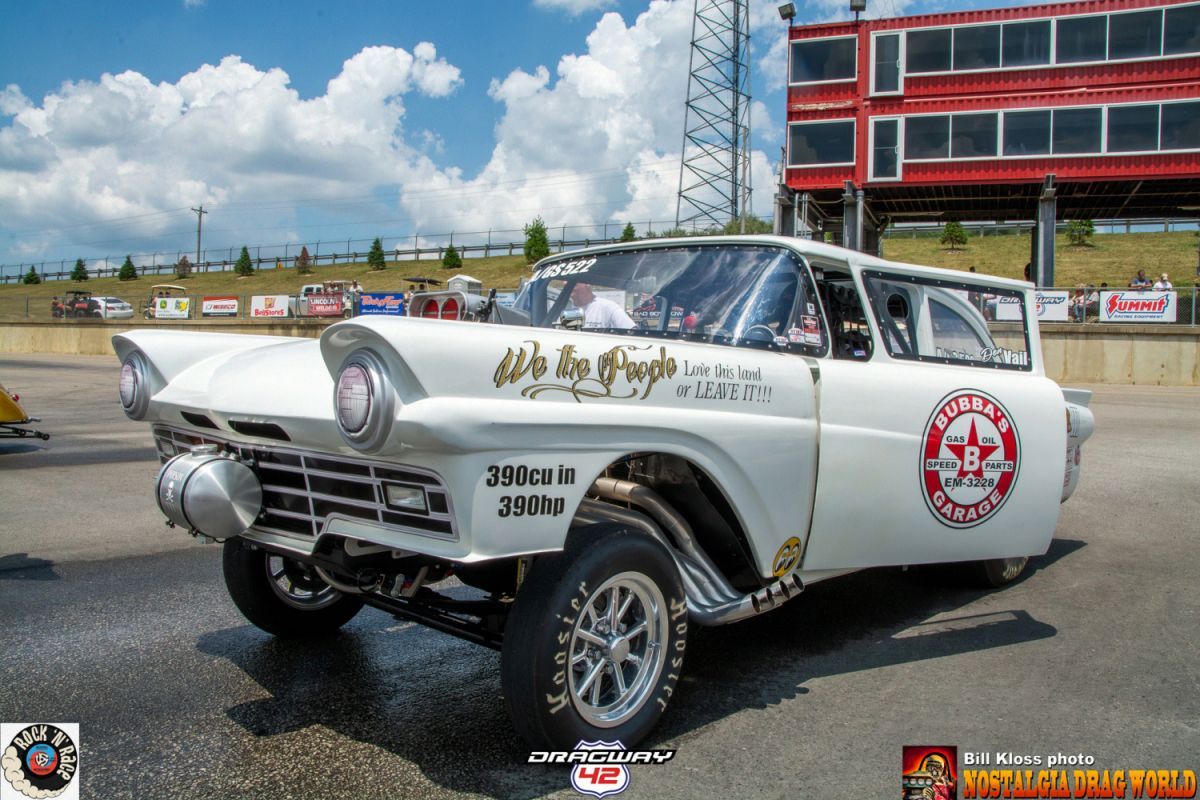 A white car with a skull on the side of it