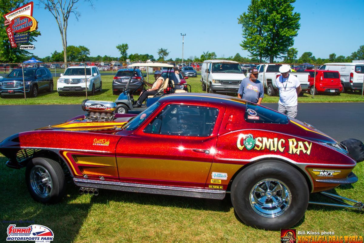 A red and gold corvette with the word cosmic ray on the side