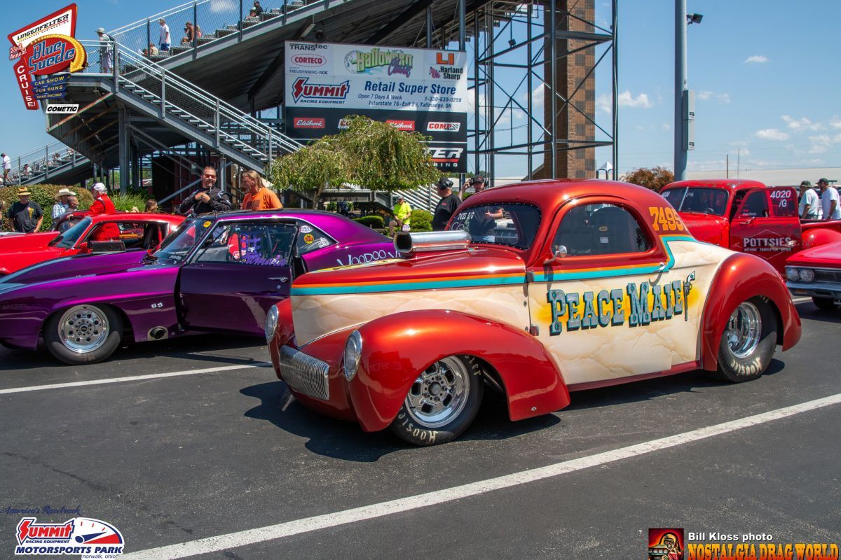 A red and white car with the word peaceman on it