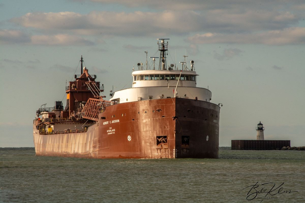 A large ship is floating on top of a body of water.